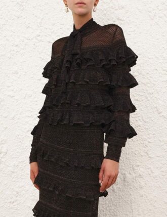 Haut à volants et col noué Rebellion, noir métallisé, en ligne