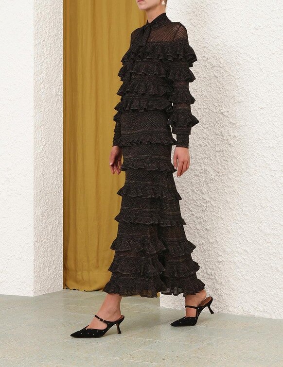 Haut à volants et col noué Rebellion, noir métallisé, en ligne Haut à volants et col noué Rebellion, noir métallisé, en ligne